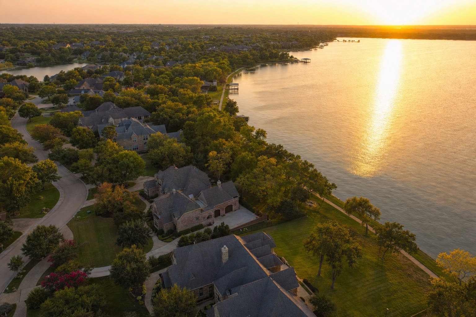Aerial view of a North Texas master-planned community at golden hour